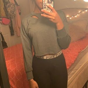 Dark gray crop top with rips in the back